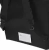 Close-up view of the back of a black bag with straps and a label. Produktbild-Vorschau