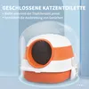 A closed cat litter box with an orange and white design, shown with a transparent dome cover and a scoop attached to the side. The background is a gradient of light blue. Náhled obrázku produktu