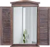 A mirror framed to look like a window with shutters, set against a white background. Náhľad obrázku produktu