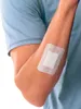 A person's arm with a bandage on it. Anteprima dell’immagine prodotto