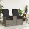 Two outdoor chairs with cushions and a small table between them, on a patio. Podgląd zdjęcia produktu