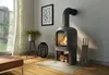 A living room scene with a fireplace, window, and furniture. Produktbild-Vorschau