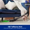 A person is using a cordless vacuum cleaner to clean under a blue sofa, with green light illuminating the area being cleaned. Produktbild-Vorschau