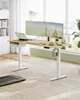 A standing desk setup in a bright room with large windows. Produktbild-Vorschau