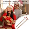A couple celebrating Christmas, with the man surprising the woman with a gift. Produktbild-Vorschau