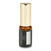 A product shot of a small glass bottle with a gold cap and a black label. Produktbild-Vorschau