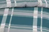 A close-up view of a plaid patterned duvet cover and pillowcase. Produktbild-Vorschau