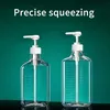 Two clear plastic pump bottles with white pumps and tubes, against a green background. Produktbild-Vorschau