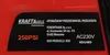 A close-up of a label on a red product. Náhled obrázku produktu