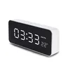 A white digital alarm clock with a black screen displaying the time and temperature. Anteprima dell’immagine prodotto