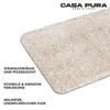 A close-up of a beige carpet or mat with text describing its features. Anteprima dell’immagine prodotto
