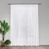 A white sheer curtain hangs in front of a window, with two potted plants on the left side. Produktbild-Vorschau