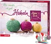 A ROTH "WollKram" Adventskalender 2023 with crochet ornaments and yarn. Produktbild-Vorschau