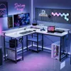 A modern gaming desk setup with multiple monitors, RGB lighting, and accessories. Náhled obrázku produktu