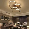 A modern living room with a sofa, armchairs, and a unique ceiling lamp. Náhled obrázku produktu