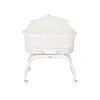 A white baby bassinet with a mosquito net on a white stand, photographed against a white background. Anteprima dell’immagine prodotto