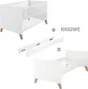 A white crib and a white toddler bed are shown, along with assembly parts and a product code. Produktbild-Vorschau