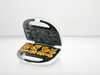 An open waffle maker with animal-shaped waffles inside. Produktbild-Vorschau