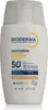 A white bottle of Bioderma sunscreen with text and logos on it. Náhled obrázku produktu