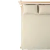A top-down view of a bed with beige sheets and two pillows. Produktbild-Vorschau