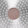 Close-up of the bottom of a pot with a textured pattern of circles and a central circular emblem. Náhled obrázku produktu