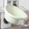 A cream-colored plastic basin is shown in a laundry room setting, with a washing machine and drying rack blurred in the background. Produktbild-Vorschau