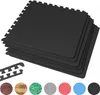 A stack of black interlocking foam mats with a few smaller pieces and color swatches at the bottom. Produktbild-Vorschau