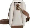 A side view of a white handbag with brown trim and strap. Náhľad obrázku produktu