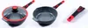 Three pans and a detachable handle are displayed against a white background. Produktbild-Vorschau
