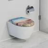 A modern white wall-mounted toilet with a decorative toilet seat featuring a sunset sky and beach boardwalk motif. Anteprima dell’immagine prodotto