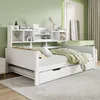 A white daybed with a pull-out trundle bed and a bookshelf headboard, set in a bedroom with green walls and a green vanity. Náhled obrázku produktu