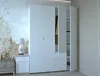 A white wardrobe with open doors, showing clothes inside, next to a bedside table with a lamp. Náhled obrázku produktu