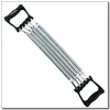 A chest expander with black handles and silver springs, isolated on a white background. Voir les images du produit