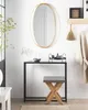 A stylish entryway with a console table, mirror, and stool. Náhled obrázku produktu