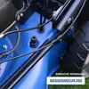 A close-up view of a blue lawnmower with black components, showing a water connection feature. Produktbild-Vorschau