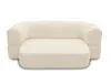 A cream-colored sofa with a rounded back and a chaise lounge extension, presented against a white background. Produktbild-Vorschau