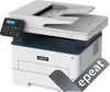 A white and blue Xerox B225dni A4 multifunction printer is shown from a slightly elevated front-left angle on a white background. A black control panel with a blue screen is attached to the left side of the printer. A grey overlay with the word "epeat" is  Produktbild-Vorschau