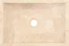 A top-down view of a rectangular marble sink with a drain hole in the center. Podgląd zdjęcia produktu
