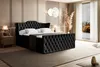A luxurious bedroom scene featuring a black velvet boxspring bed. Produktbild-Vorschau