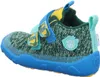 A side view of a child's shoe. Voir les images du produit