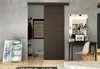 A modern interior with a sliding door, desk, and shelving unit. Náhľad obrázku produktu