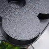 A close-up view of a black frying pan with a speckled granite coating and circular indentations. Náhľad obrázku produktu