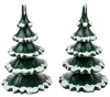 Zwei dunkelgrüne Erzgebirge-Holzbäume mit weißem Schnee auf den Ästen und glitzernder Oberfläche. Jeder Baum hat vier gestufte Ebenen und eine Spitze, Höhe je 11 cm. Produktbild-Vorschau