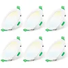Six white LED downlights with green clips are arranged in two rows of three against a white background. Náhled obrázku produktu