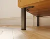 Close-up view of furniture legs attached to a wooden surface, resting on a wooden floor. Produktbild-Vorschau