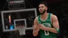 A digital rendering of a basketball player in a green jersey, with a basketball hoop and scoreboard in the background. Produktbild-Vorschau