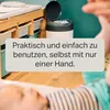 A baby's changing station with a diaper pail and a baby's legs in the foreground. Voir les images du produit