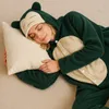 A young woman sleeps peacefully in a Snorlax onesie, hugging a pillow. Anteprima dell’immagine prodotto