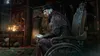 An elderly man sits in a wheelchair in a dimly lit, antique-looking room. Náhled obrázku produktu