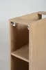 Close-up view of the top corner of a wooden cabinet, showing internal metal brackets. Podgląd zdjęcia produktu